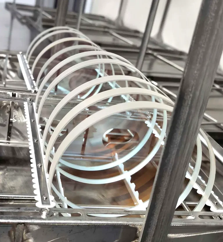 Large diameter laser optical windows arranged in a production and cleaning process