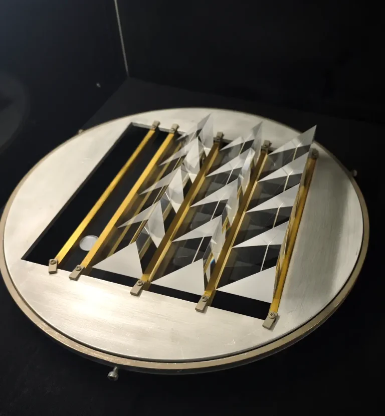 Precision laser optical prisms arranged for fiber laser optical systems