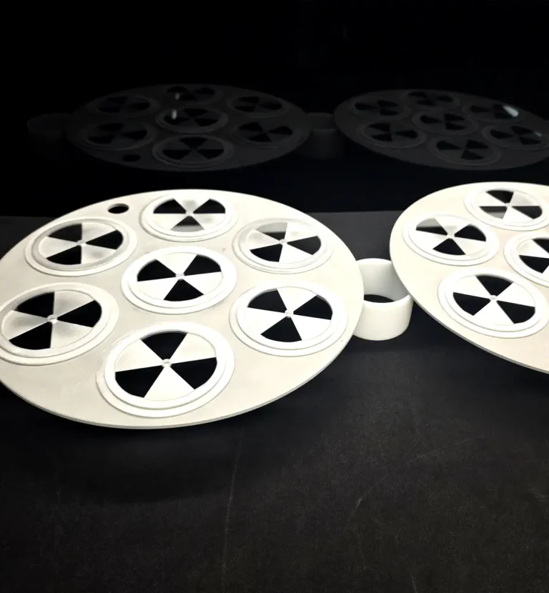 Optical components arranged in coating fixtures for precision processing