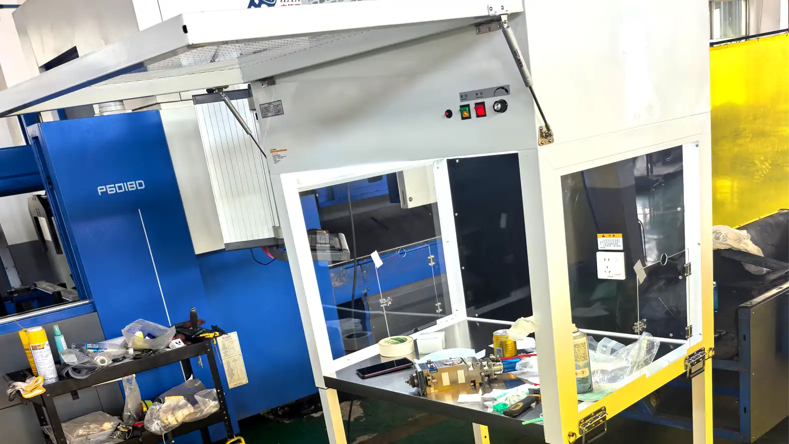 Clean workbench used beside laser equipment for replacing cutting head optical components