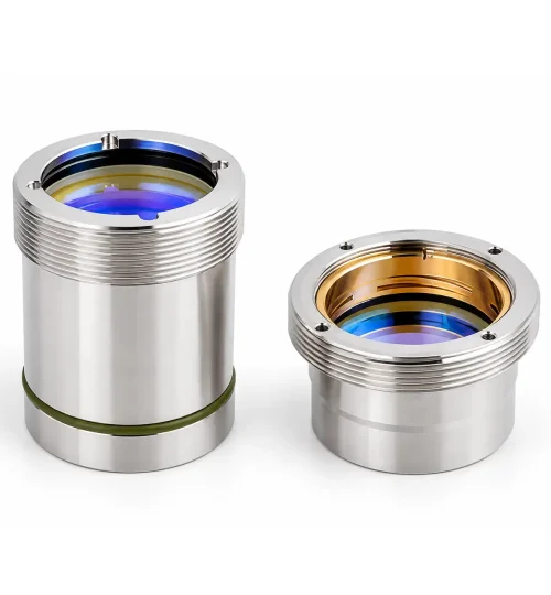 Precision lens housing assemblies with coated optics for fiber laser cutting heads